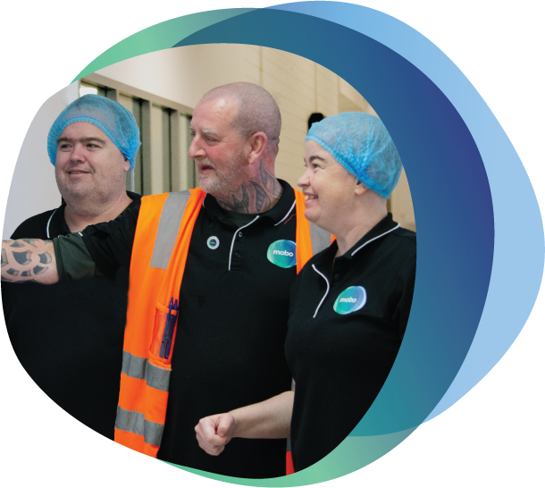 Two people with disabilities and supervisor wearing Hi Vis vest looking to the left.